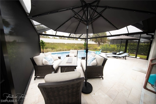 view of patio / terrace with an outdoor hangout area and glass enclosure