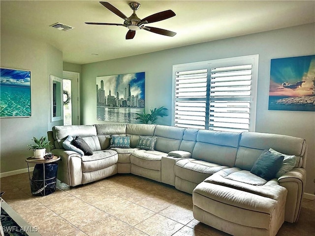 living room featuring light tile patterned floors and ceiling fan