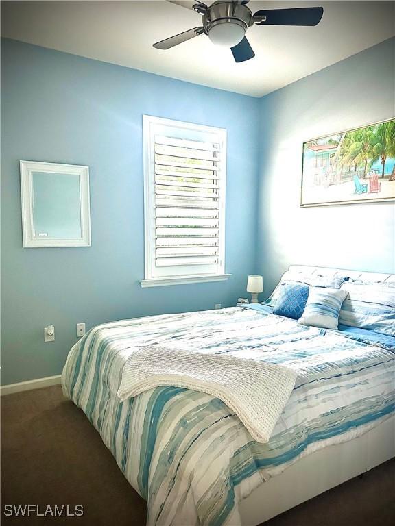 carpeted bedroom with ceiling fan