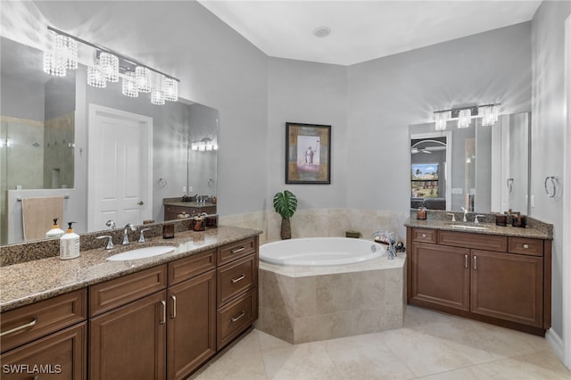 bathroom with vanity, tile patterned flooring, and independent shower and bath