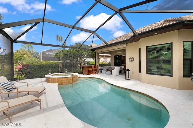 view of pool with an in ground hot tub, an outdoor bar, a lanai, and a patio