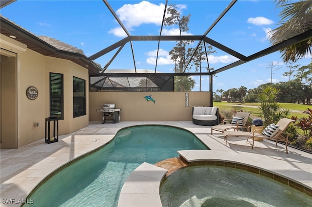 view of pool with an in ground hot tub, a lanai, a grill, and a patio