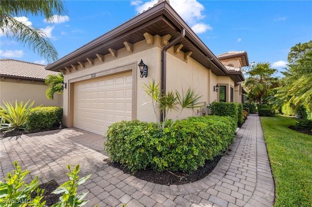 view of side of home with a garage