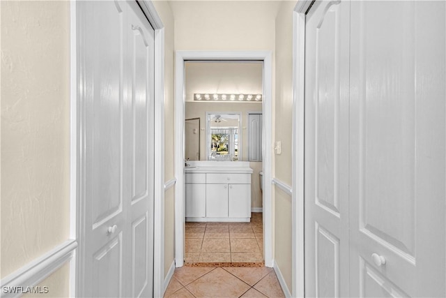 hall with light tile patterned flooring