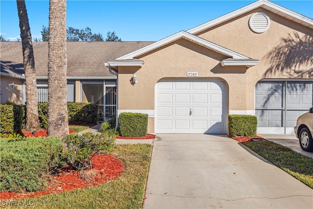 single story home with a garage