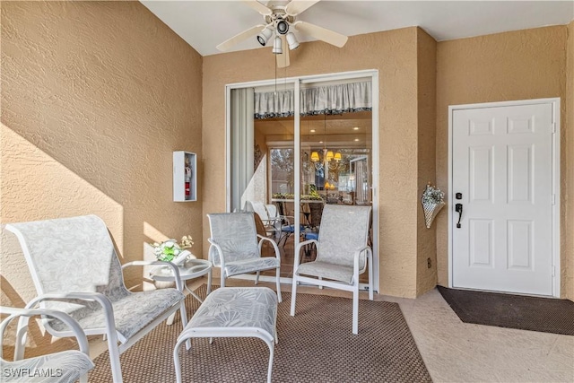 entrance to property with ceiling fan