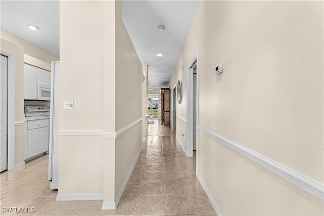 corridor with light tile patterned floors