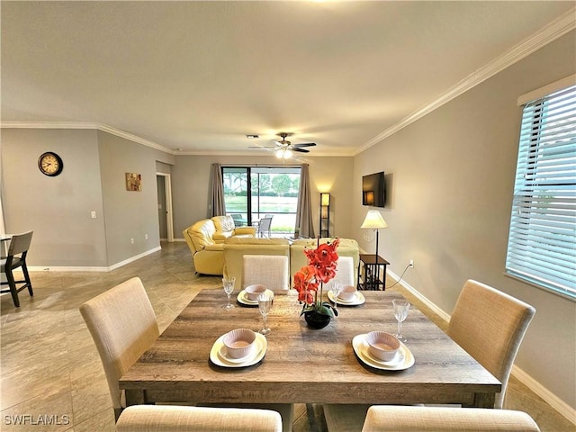 dining room featuring ceiling fan, ornamental molding, and light tile patterned flooring