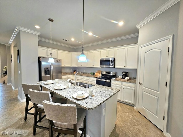 kitchen with sink, white cabinets, a center island with sink, and appliances with stainless steel finishes