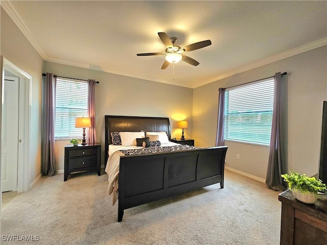 bedroom with ceiling fan, crown molding, and light colored carpet