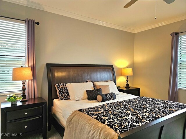 bedroom with ceiling fan and crown molding