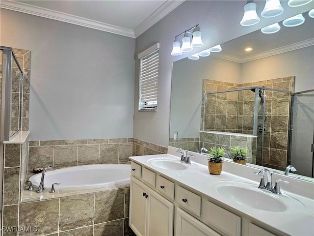 bathroom with vanity, ornamental molding, and independent shower and bath