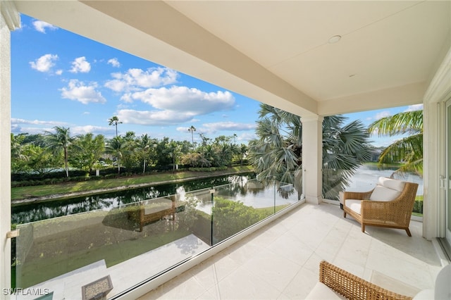 balcony featuring a water view