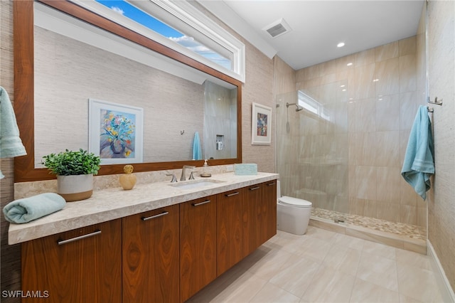 full bath with visible vents, vanity, toilet, and a walk in shower