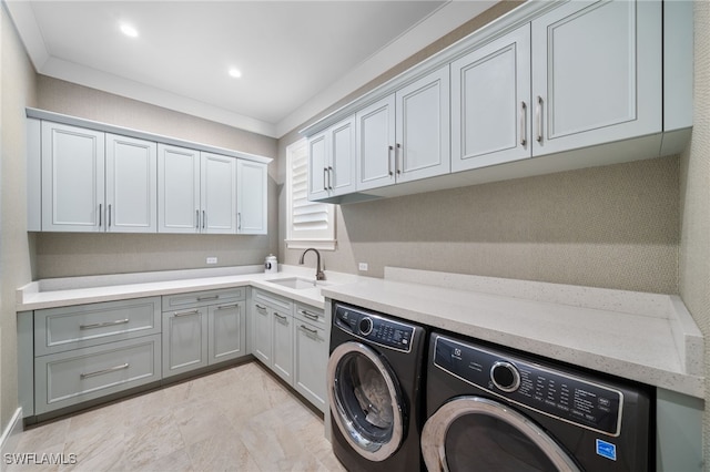 washroom with recessed lighting, separate washer and dryer, a sink, cabinet space, and crown molding