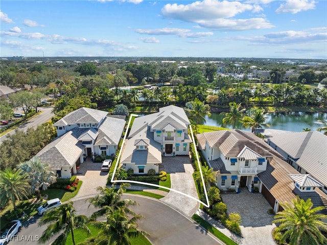 bird's eye view featuring a residential view and a water view