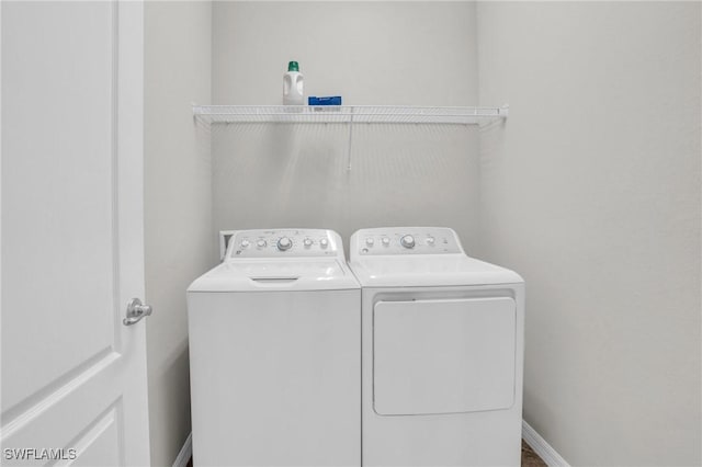 washroom with washing machine and dryer