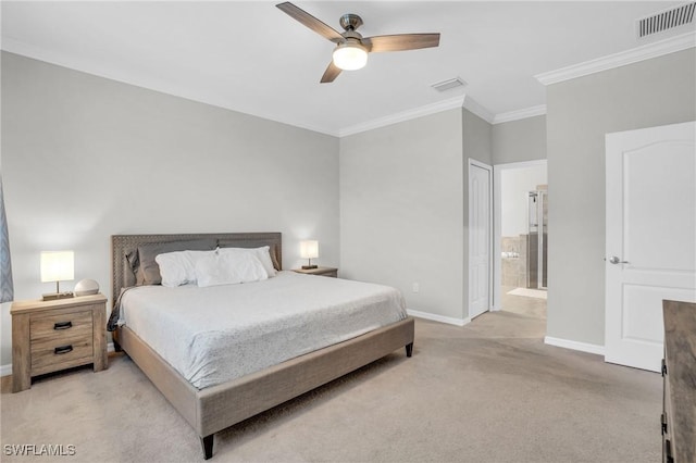 carpeted bedroom with ceiling fan, crown molding, and ensuite bathroom