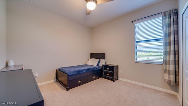 bedroom featuring ceiling fan and light colored carpet