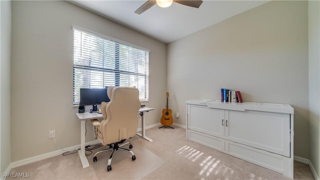 office featuring ceiling fan and light colored carpet