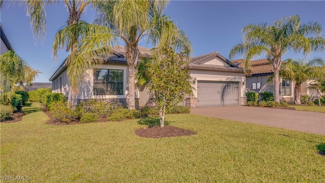 view of front of property featuring a garage and a front lawn