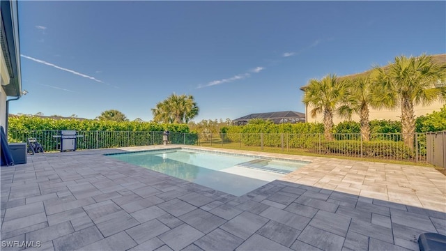 17250 Ashcomb Way, Estero, FL 33928 - view of pool featuring a patio, a fenced backyard, and a pool with connected hot tub