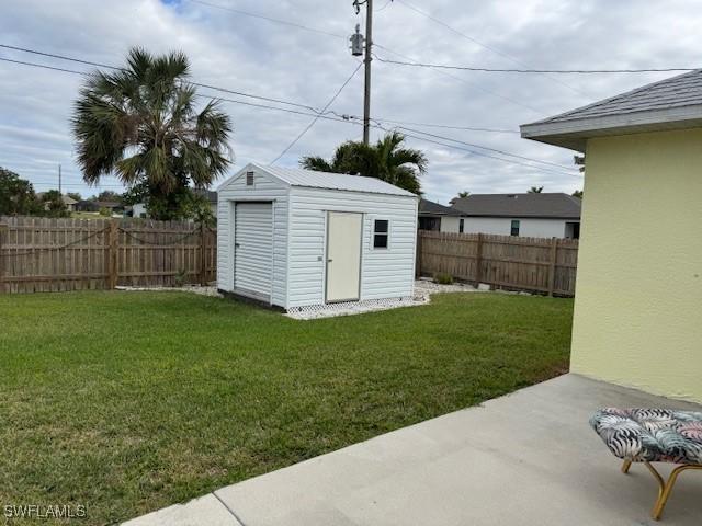 view of shed with a fenced backyard