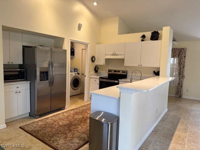 kitchen with kitchen peninsula, appliances with stainless steel finishes, high vaulted ceiling, white cabinets, and washer / clothes dryer