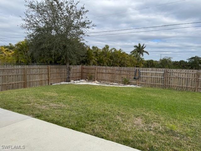 view of yard with a fenced backyard