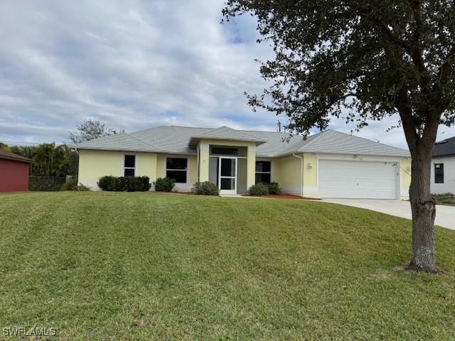 ranch-style house featuring a garage, a front yard, concrete driveway, and stucco siding