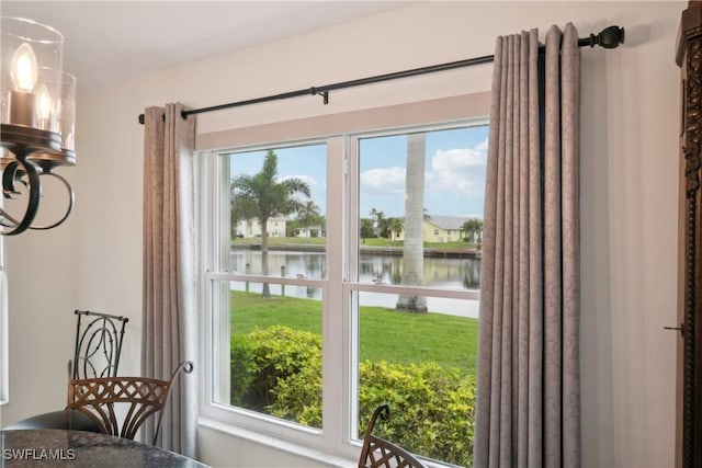 doorway to outside featuring a water view