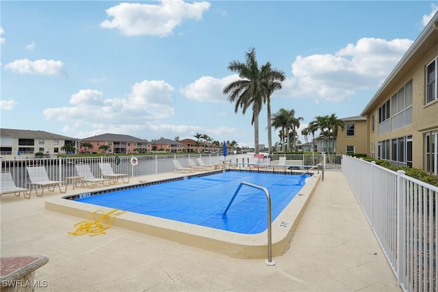 view of swimming pool with a patio