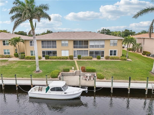 exterior space with a lawn and a water view