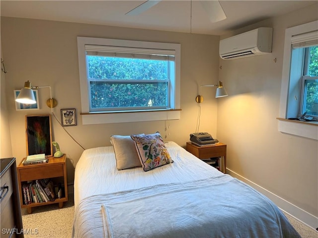 bedroom featuring ceiling fan and a wall mounted air conditioner