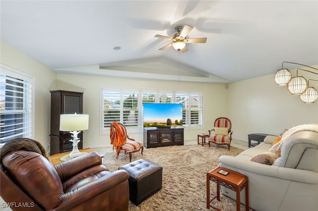 living room with vaulted ceiling, ceiling fan, and light carpet