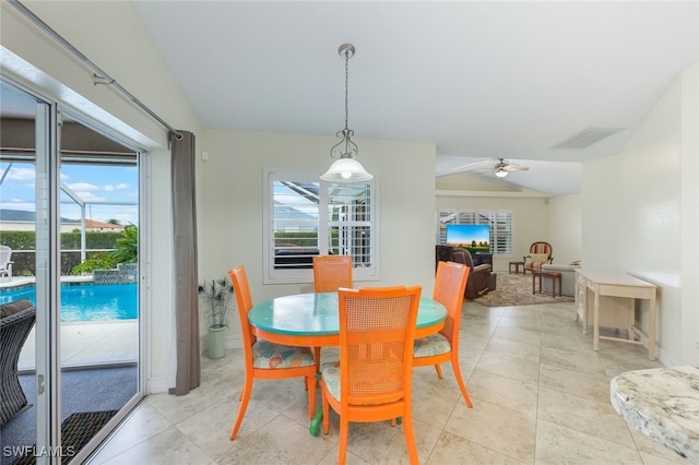 dining room featuring ceiling fan and vaulted ceiling