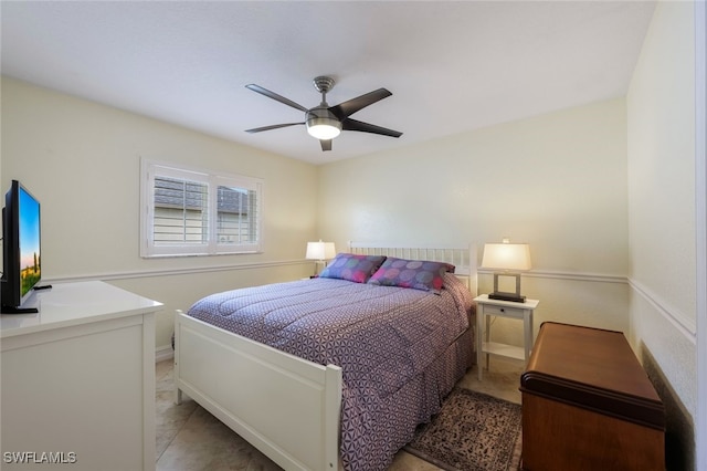 bedroom with ceiling fan and light tile patterned floors