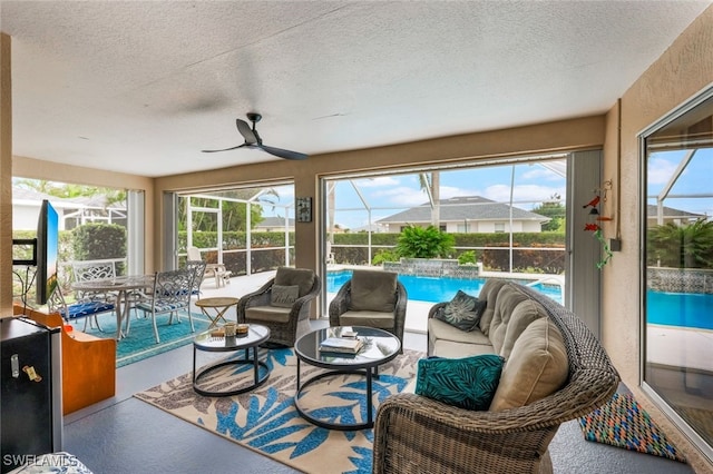 sunroom / solarium with ceiling fan and plenty of natural light