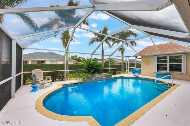 view of swimming pool with a lanai, pool water feature, and a patio