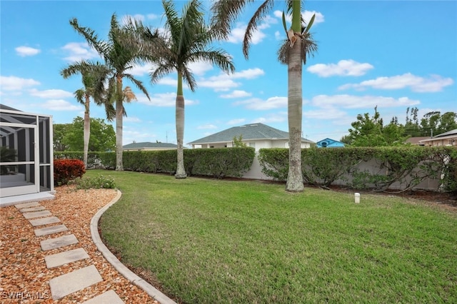 view of yard featuring a lanai