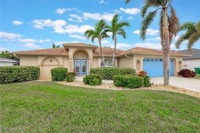 view of front facade featuring a front lawn, a garage, and french doors