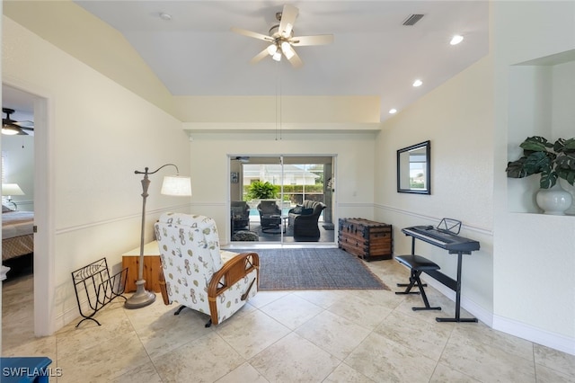 sitting room featuring ceiling fan and lofted ceiling