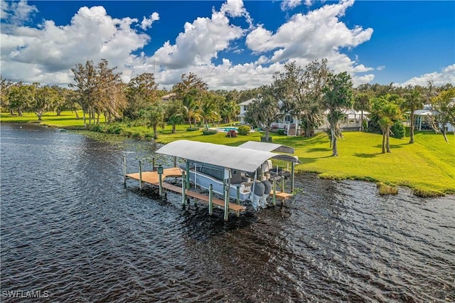 dock area with a water view and a yard