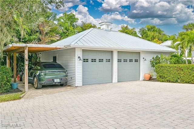 garage featuring a carport