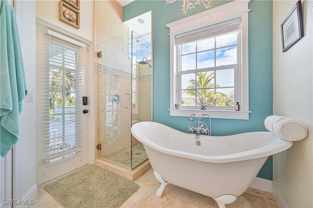 bathroom featuring a wealth of natural light and plus walk in shower