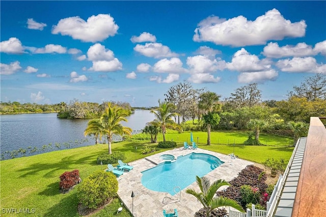 view of swimming pool with a patio, a water view, and a lawn