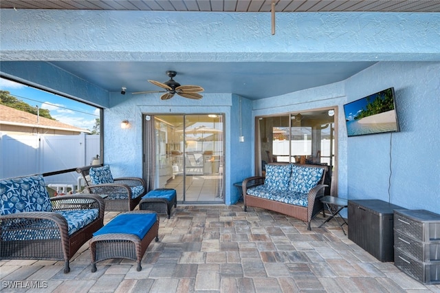 view of patio with ceiling fan and an outdoor hangout area