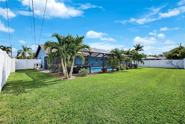 view of yard featuring a lanai and a fenced in pool