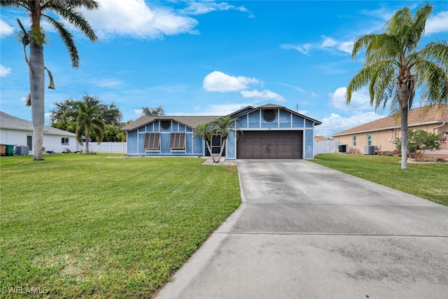 ranch-style home with central air condition unit, a front lawn, and a garage