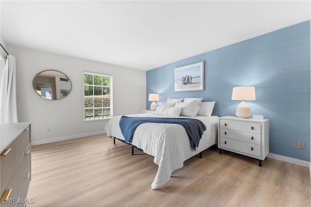 bedroom with light wood-type flooring